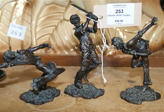 2 bronze cricket figures